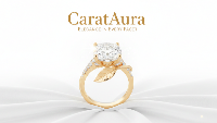 Gold ring with a large diamond on a white background, featuring the brand 'CaratAura'.